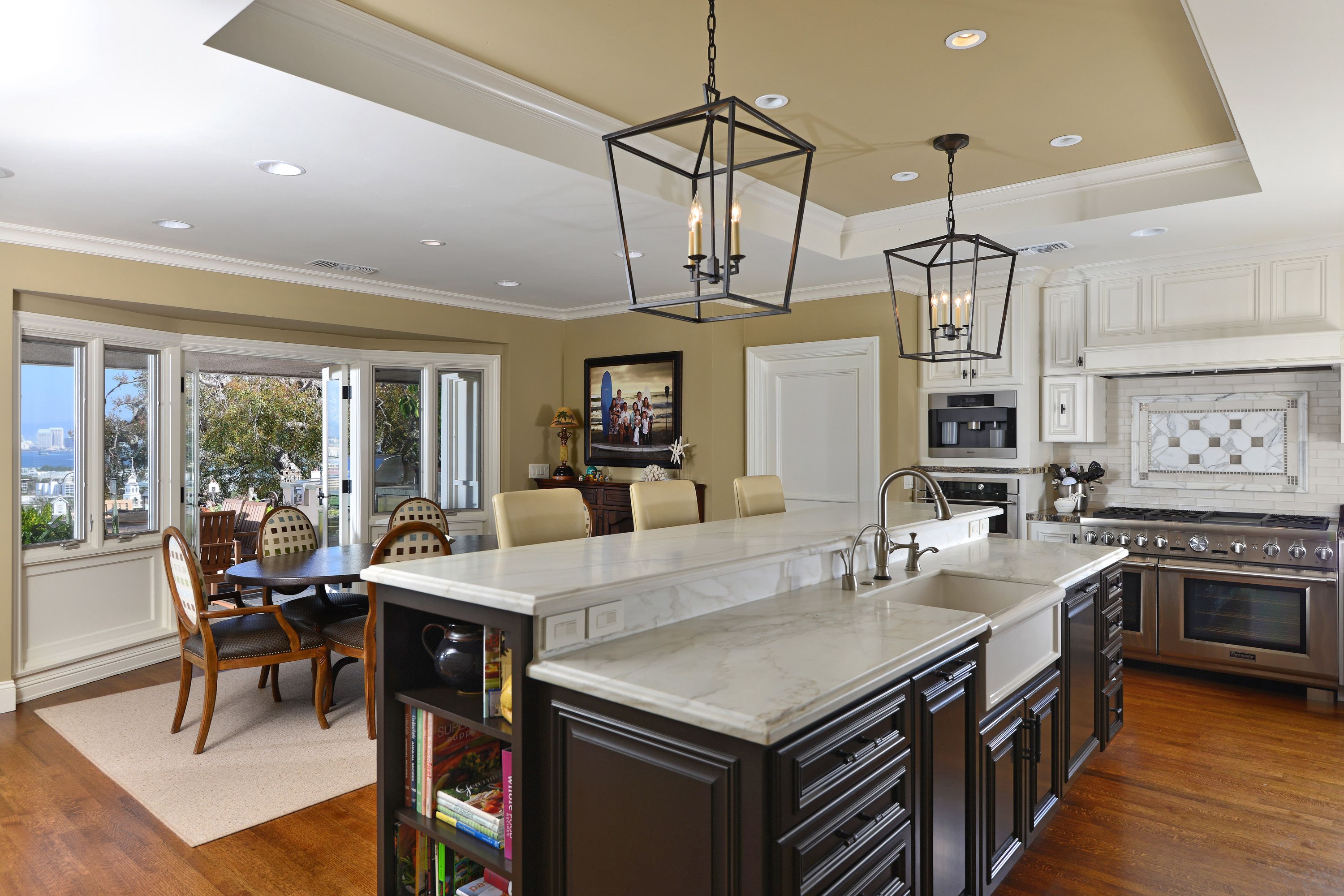 Open floor plan with kitchen and dining area. Cool